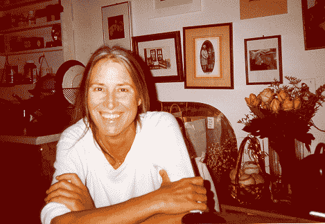 Carol Denney in a high wind overlooking the English sea.